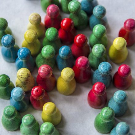 pawns in green, red, yellow, and blue colors