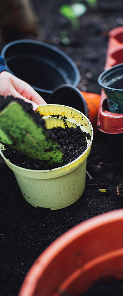 planters being potted with soil